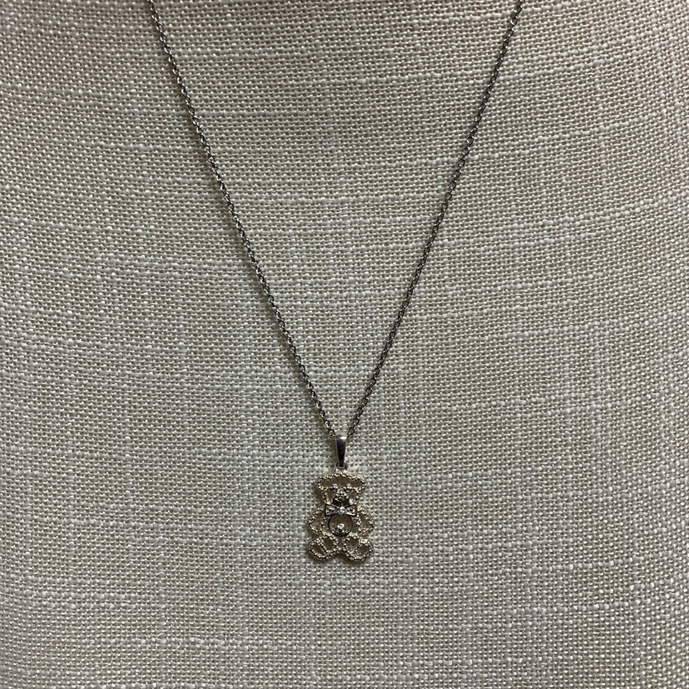 Silver necklace with a sparkly teddy bear pendant faux diamond accents